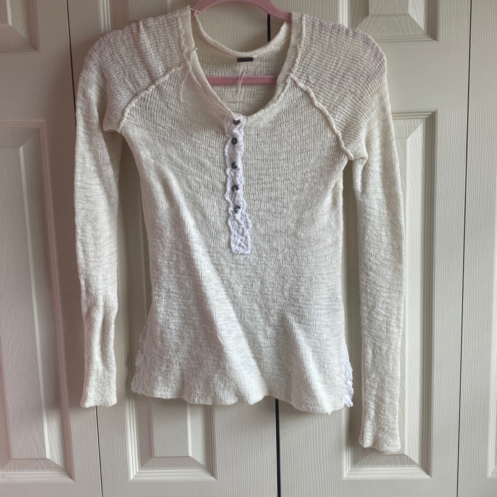 Soft sweater, with half button up front, and side slits